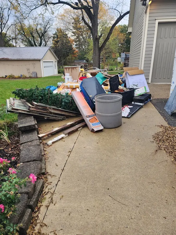 Dumpster being loaded with debris for Demolition Dumpster Rental in Mint Hill